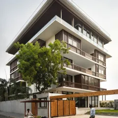 We believe a home should be in dialogue with its surroundings. This multi-generational residence in Nagpur, 'The Light House', uses operable timber screens and staggered balconies to create privacy and shade, while remaining connected to the life of the neighborhood.