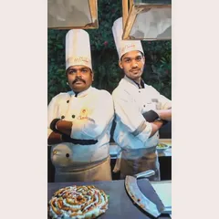 Two of my talented chefs, proud to stand by their delicious creation. They are the artists behind the flavourful memories we serve.