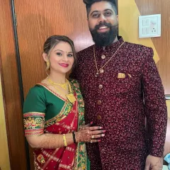 A lovely couple portrait. The client's makeup is radiant and her hair is styled in a beautiful updo, making her look perfect for the occasion.