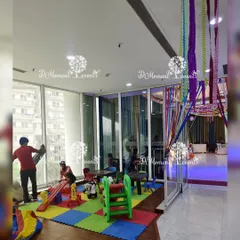 For parties with young guests, I can set up a dedicated and safe kids' play area. This setup includes soft flooring, slides, and other play equipment to keep the little ones happily occupied.