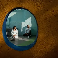 You can get creative with framing and light at my Santorini inspired set. The contrast between the textured yellow wall and the cool blue tones inside provides a unique, artistic backdrop for modern couple portraits.
