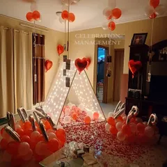 This view showcases how our cabana tent becomes the centerpiece of a room. We personalize the experience by hanging photos from the ceiling balloons, making it a walk down memory lane for the happy couple.
