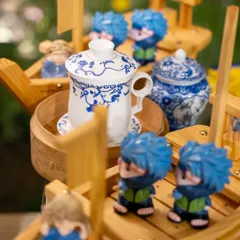 We believe in playful presentation. Here, our Asian-themed decor with fun ninja figurines adds a whimsical touch to the Teppan-yaki station, making it even more engaging for guests.
