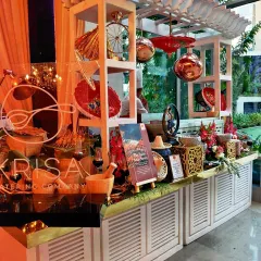 A closer look at our Malay Satay station, complete with thematic props like a conical hat and mortar. These details help transport guests and enhance the overall culinary experience.