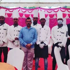 A group photo of the Sukhdev Caterers team, showcasing our professional chef uniforms and commitment to service.
