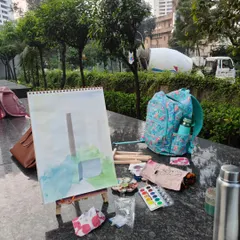 The artist's setup during our outdoor class. With a portable easel and watercolors, you can create a masterpiece anywhere.