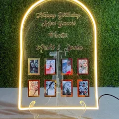 Make a statement with this personalized neon sign. It features an arch design with your custom quote in 3D letters and space to hang eight of your favorite mini photos.