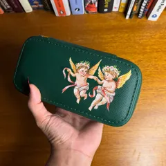 Another angle of the hand-painted jewelry case. The detail on the cherubs' wings and the flowing ribbons was painted with specialized, durable paints.