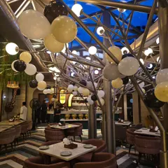 A shot of the venue for the 50th birthday, with balloons placed around the room to complement the main backdrop.
