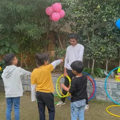 I love creating fun-filled events for the community. At our launch party, kids enjoyed a variety of games, including hula hoop challenges, which brought smiles to everyone's faces.
