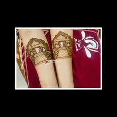 The startup bands on the arms, featuring traditional 'palki' or palanquin designs.