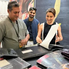 The joy of discovery. Actress Tisca Chopra's delight is evident as she explores the pages of our fabric books, filled with stunning designs from the world's leading houses.