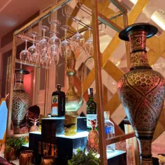 The beauty of our Sufi theme is in the details. This shot highlights the ornate brass vases and hanging glassware that contribute to a rich, royal, and mystical atmosphere.