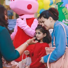 A young guest is delighted to meet Peppa Pig up close. Our performers are great at interacting with children and making them feel comfortable and excited.