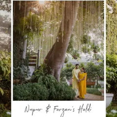 A beautifully framed portrait of the couple during their Haldi ceremony at Gallops, Mumbai. The sun flare and hanging crystals from the tree add a magical touch to the scene.