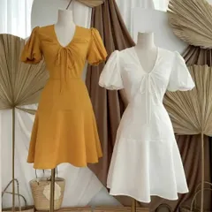 Showcasing variations of my custom A-line dress design. This style features a V-neck with a delicate tie-front detail and soft puff sleeves. I offer these tailored dresses in a range of colors, like this sunny yellow and classic white.