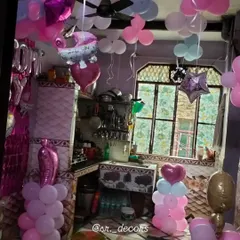 This image shows how I can decorate a larger area of a room. The setup includes balloon pillars, ceiling balloons, and character foils to create a complete party atmosphere for welcoming your little one home.