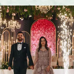 A couple's entry into their reception sets the tone for the entire evening. We framed this couple's walk-in with sparkling cold pyros against a beautiful floral backdrop, creating a grand and celebratory welcome.