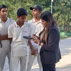A sports nutritionist interacts with our trainees, taking notes to provide personalized dietary advice. We believe proper nutrition is a critical component of athletic success.