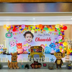 An alternate full view of the Cocomelon stage, showing the arrangement of character cutouts.