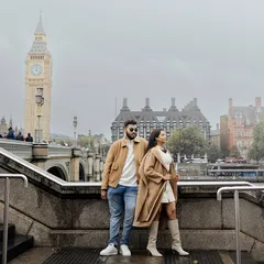 Against the iconic backdrop of London's Big Ben, we styled this couple in coordinated neutral-toned coats. The look was designed to feel classic and sophisticated, a perfect match for the city's timeless charm.