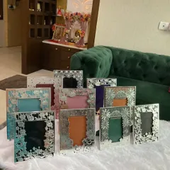 A beautiful display of my silver photo frame collection. With various designs and colorful backings, these frames are perfect for preserving your cherished memories and make for a wonderful, personal gift.
