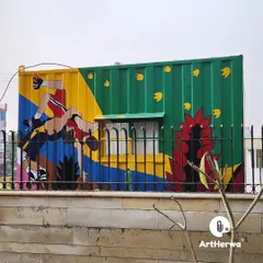A dynamic sports-themed mural on another side of the shipping container. This project shows our versatility in painting a wide range of subjects in a consistent, colorful style.