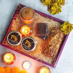 Inside the 'Bliss' hamper, you'll find dessert jars, a teacake, brownies, and even vegan and gluten-free ladoos. It’s a curated selection of sweet and savoury goodies for the festive season.