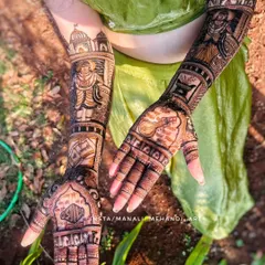 A unique bridal mehandi inspired by Marathi culture, featuring a portrait of Vitthal Mauli. The design is captured in natural light, highlighting the fine details and the cultural significance for the bride.