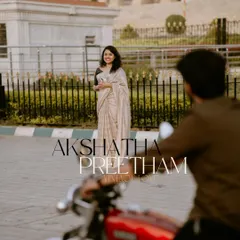 A classic "filmy" moment, with the groom-to-be on a vintage motorcycle looking back at his partner. This shot is full of retro romance and style.