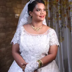Simple glam for this beautiful bride. Her makeup features a soft smokey eye and a warm nude lip, paired with a classic updo and tiara for a look that is both modern and princess-like.