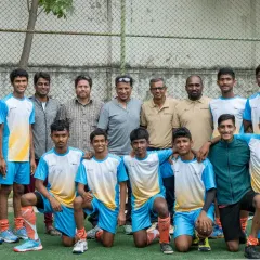 Our sub-junior boys' team with our founder Jude Felix, Olympian coach Sabu Varkey, and other trustees. This shows the depth of leadership and experience guiding our players.