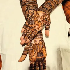 A different angle of the same storytelling mehendi, highlighting the flow of the design from the palm to the forearm.