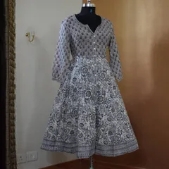 This grey and white block-printed Anarkali is a must-have for its understated charm. The button-down front and full sleeves give it a classic, versatile appeal.