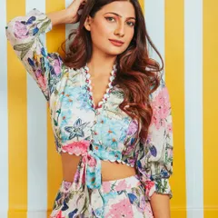 A bright and summery shot for a brand's floral co-ord set. The striped yellow background makes the photo pop and is perfect for an e-commerce website.
