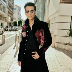 Inspired by celebrity style, this black indowestern long coat features bold, hand-embroidered floral motifs on the shoulders. I design these pieces to be conversation starters, ideal for cocktail events or high-profile parties.