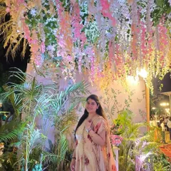 Posing under a stunning floral ceiling at a wedding reception. The decor and ambiance of an event inspire the style of dance I create for my clients.