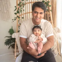 A proud papa with his sweet baby girl. The smiles say it all. Including dad in the photoshoot is so important for capturing the whole family's love story.