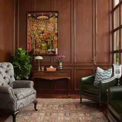 I love creating quiet corners for reflection. This intimate, wood-panelled study in a bustling office serves as a retreat for calm conversation or script read-throughs. The space is anchored by a vintage Ram Durbar painting, infusing it with a sense of tradition and reverence for storytelling.