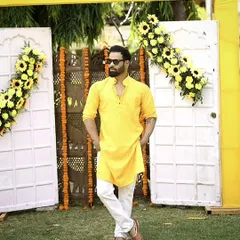 Rocking a bright yellow kurta for a daytime event. This traditional look is perfect for festive occasions like Haldi ceremonies or daytime parties.