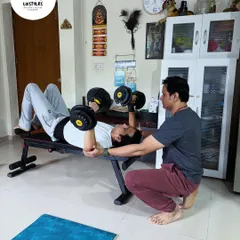 Personal training is about guidance and safety. Here, I am providing hands-on support to a client during a dumbbell bench press, ensuring he maintains perfect form to maximize results and prevent injury.