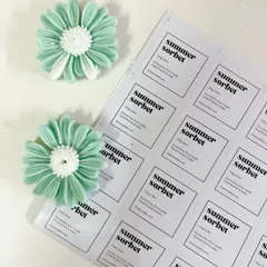 Studio days. Labeling our 'Summer Sorbet' candles and preparing the flower wax toppers.