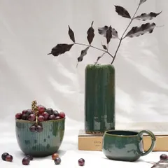A collection of pieces finished with our Lush Green glaze. This versatile, stable glaze offers a rich forest green hue with subtle blue speckles, working beautifully on both light and dark stoneware clay bodies.