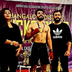 We don't just train, we build champions. Here is one of our athletes with his gold medal from the Bangalore District K1 Kickboxing Championship. This is the result of discipline and hard work.