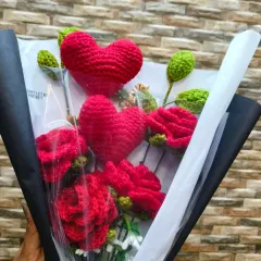 A close up of my new Red Heart Rose Bouquet. I mix deep red roses with plush crochet hearts, all wrapped up to create a truly romantic and unique gift.