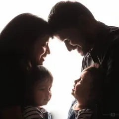 This silhouette shot is a beautiful and artistic way to capture the intimacy of your family. The focus is on the connection and love shared between parents and their children.