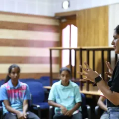 An instructor leads an interactive discussion with participants of the leadership program. These small group settings encourage open dialogue and personalized guidance, helping athletes build confidence and find their voice.