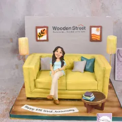 The full view of the sofa cake, showing the entire edible room setup.