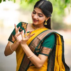 A close-up look at the 'kartarimukha' mudra while modeling this lovely yellow saree. My dance background influences my work as a model.