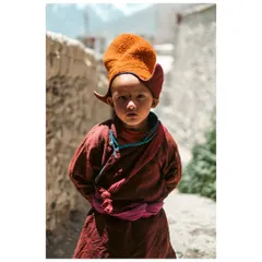 The innocent yet profound gaze of a young monk in Karsha, Zanskar Valley. For me, portrait photography is about connecting with a person's story and reflecting their spirit in a single frame.